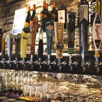Extensive craft beer tap wall with local Minnesota breweries